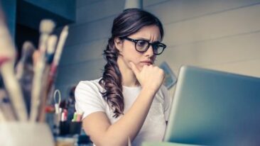 woman looking at computer